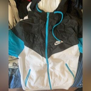 BLACK BLUE AND WHITE NIKE ZIP UP WINDBREAKER.    OPEN FOR NEGOTIATIONS